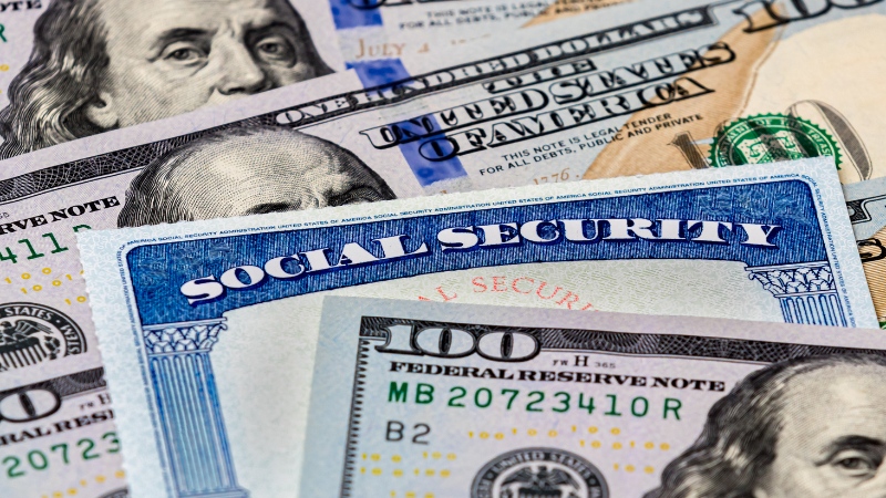 Social security card with $100 bills