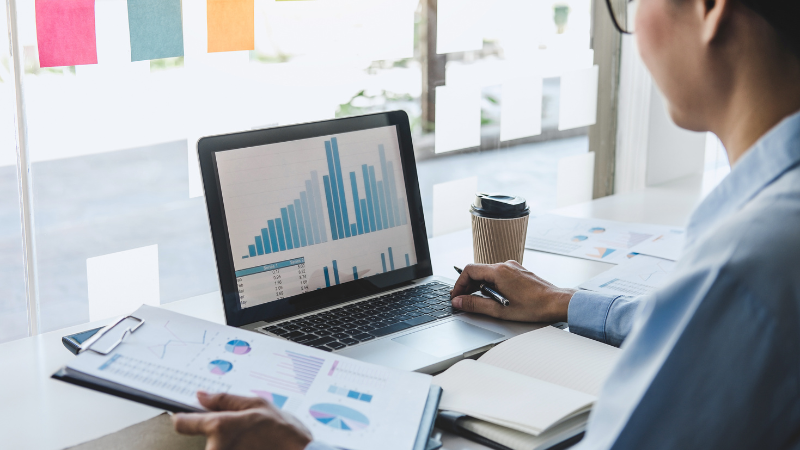 Person looking at report on computer in office
